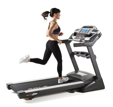 In this photo a girl running on sole f65 treadmill